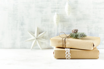 An Arrangement of Christmas Presents wrapped in gift paper in natural shades a