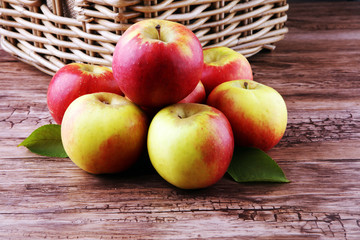 Ripe red apples on wooden background summer concept