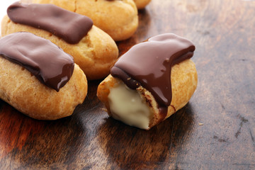 Traditional French dessert. Eclair with chocolate icing. Pastery concept