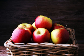 Ripe red apples on wooden background summer concept