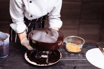 cake covered in chocolate. Mirror glaze