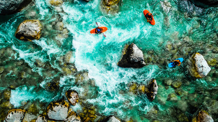 Emerald waters of Soca river, Slovenia, are the rafting paradise for adrenaline seekers and also nature lovers, aerial view. - obrazy, fototapety, plakaty