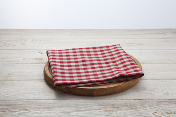 Napkin. Stack of colorful dish towels on white wooden table background top view