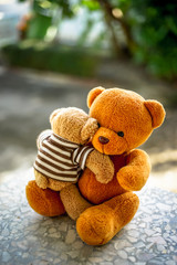 two bear dolls with dramatic tone, select focus the one bigger