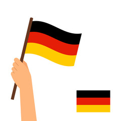 Human hand holding flag of Germany