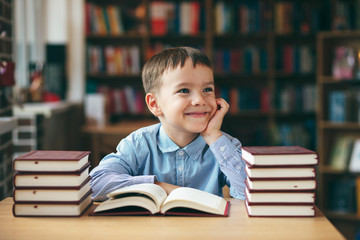 Smiling boy with books