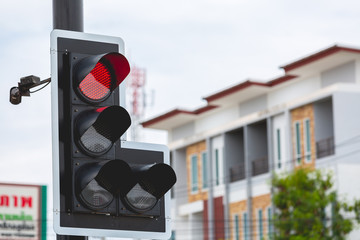 Red traffic light in the city street