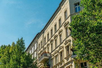 luxury corner house at prenzlauer berg framed by trees