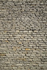 Large grey brick wall in the city