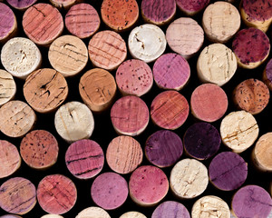 Natural background of wooden plugs in different shades and colors.
