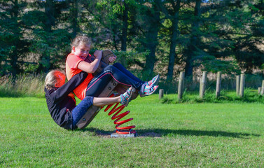 Two young girls having fun outside on a warm and sunny day