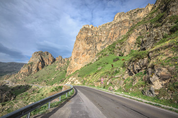 Mountain road in Alps. Touristic route to beautiful destination. Nobody