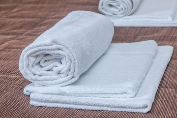 Fototapeta na wymiar Three rolled towels