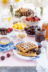 Table Set for Breakfast with Waffles and Berries