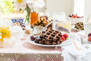 Table Set for Breakfast with Waffles and Berries