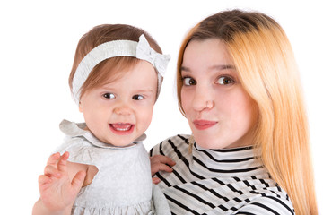 Two cousins on a white background. Infant and adult.