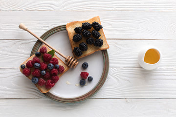 fresh berries on toasts