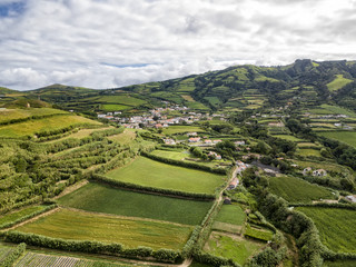 Fototapeta na wymiar Aerial view of the small town of Ginetes on the Azorean Island of Sao Miguel in Portugal.