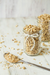 Almond Granoli In Glass Jar With Spoon