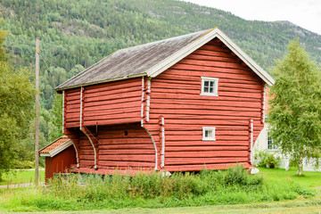 Old red wooden loft house or loft shed. Location Norway.