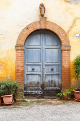 Fototapeta na wymiar Old wooden door on a house