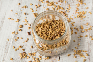 Almond Granola Breakfast Cereal In Glass Jar From Above