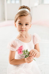 The little balerina in white tutu in class at the ballet school © master1305