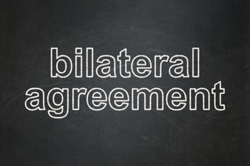 Obraz premium Insurance concept: Bilateral Agreement on chalkboard background