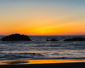 Silhouette of rocks at sunset Lincoln City Oregon
