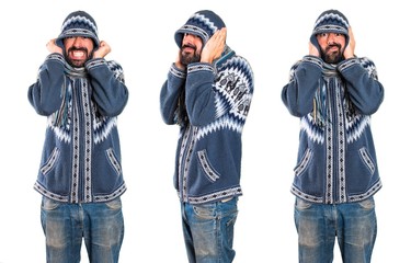 Set of Man with winter clothes covering his ears