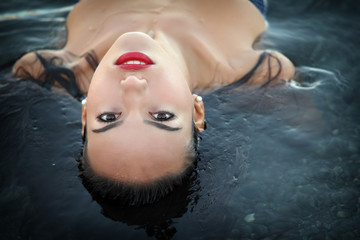 Young woman beauty portrait in water