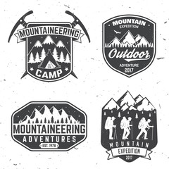 Vintage typography design with mountaineers and mountain silhouette.