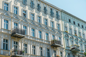 Fototapeta na wymiar white and blue apartment facades in a row
