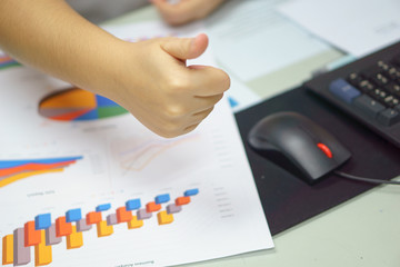 young businesswomen hand thumb up for her successful in her business agreement or career or young universities student thumb up for her successful education.  study or business success concept