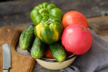 Fresh tasty vegetables on wooden background view