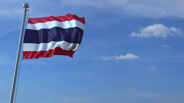 Commercial airplane landing behind waving Thai flag. Travel to Thailand conceptual animation