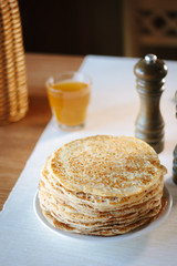 Pile of russian pancakes over the plate at restaurant