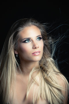 young blonde blue eays woman beauty portrait studio