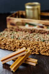 Dry pet food on black wooden table.