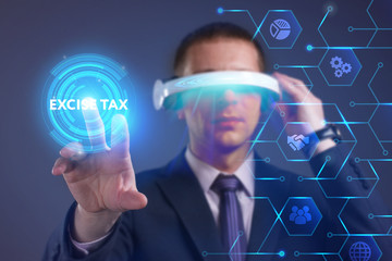 Business, Technology, Internet and network concept. Young businessman working on a virtual screen of the future and sees the inscription: Excise tax