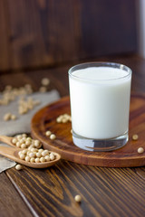 Soy milk with soy beans around it.