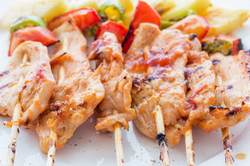 Close Up,Grilled chicken barbecue on bamboo skewers on white plate
