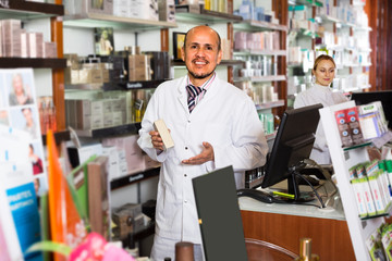 Fototapeta na wymiar ﻿pharmacists standing with a cash desk