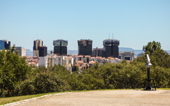 A view of Lisbon from the viewpoint of Parque Recreativo do Alto da Serafina at Monsanto Forest Park - modern buildings in the background