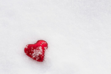 Fototapeta premium Red Heart Covered In Snow For Valentines Day