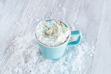 Mug of Winter Hot Chocolate With Whipped Cream and Snow