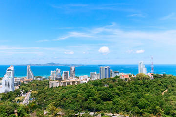 High Pattaya ocean view. Blue sky with clouds, summer green trees, Thailand beach