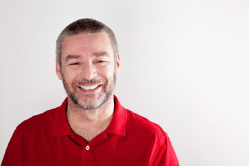 Fototapeta premium Stylish mature man laughing to the camera