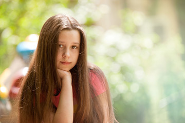 Obraz premium Beautiful teenage girl with a smiling and calm face expression