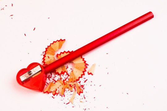 red sharpener and pencil